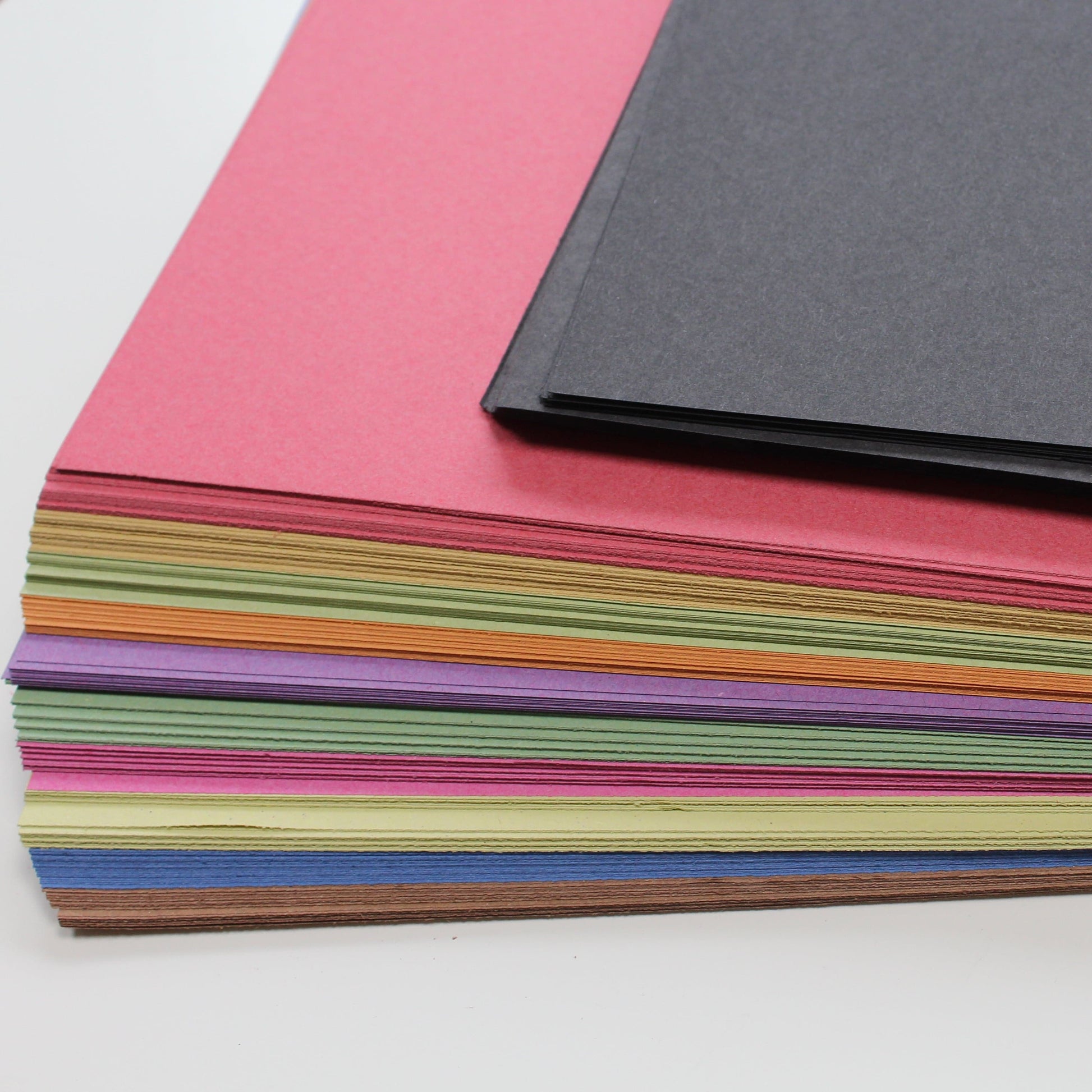 Recycled bright and black sugar paper
