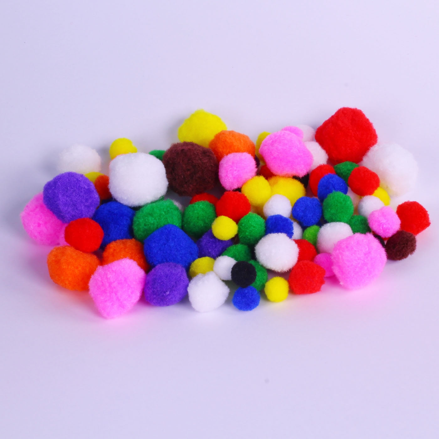 assorted brightly coloured pom poms