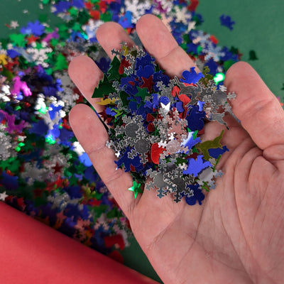 Hand holding Christmas sequins