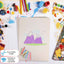 White Sugar Paper with mountain drawing surrounded by art supplies on a white background