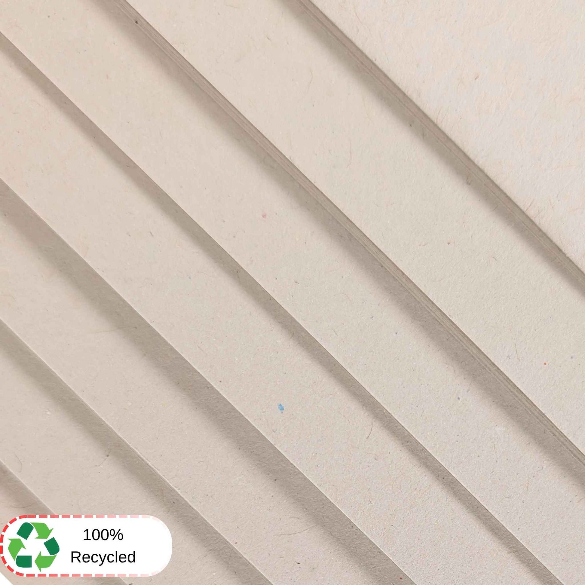 White textured sugar paper with a 100% recycled label